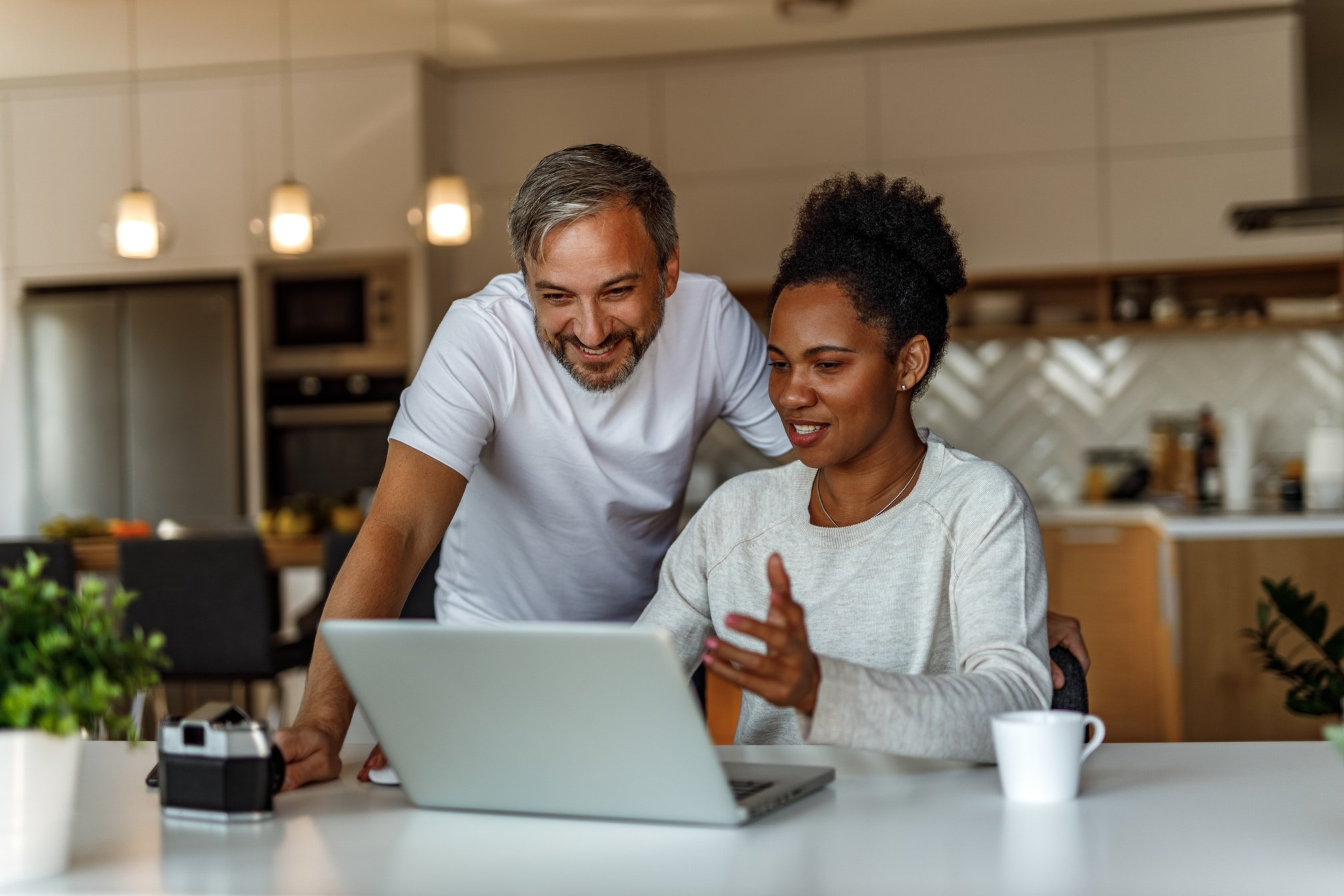 Two adults using learning something new online.